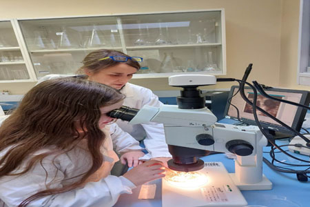 Elvira and Robin Troy looking for Freshwater Pearl Mussels from the Marine Institute’s captive breeding program at the Marine Institute's Research Facility in Newport, Co. Mayo.