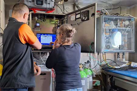 Instrument Technician Lukasz Pawlikowski (P&O Maritime) and Marine Chemist Margot Cronin (Marine Institute) working on the General Oceanics pCO2 system on board the RV Celtic Explorer
