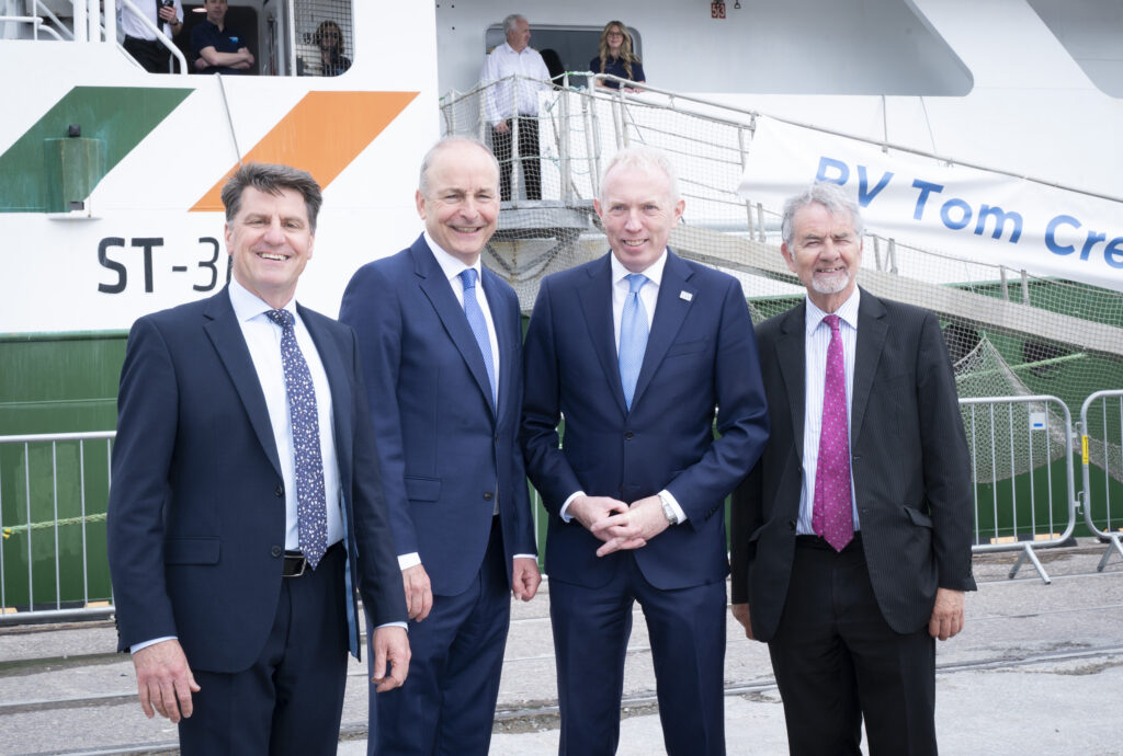 Taoiseach Micheál Martin, Minister of State Timmy Dooley, CEO of the Marine Institute Rick Officer and Chair of the Marine Institute board Martin Sisk on the background of the RV Tom Crean.