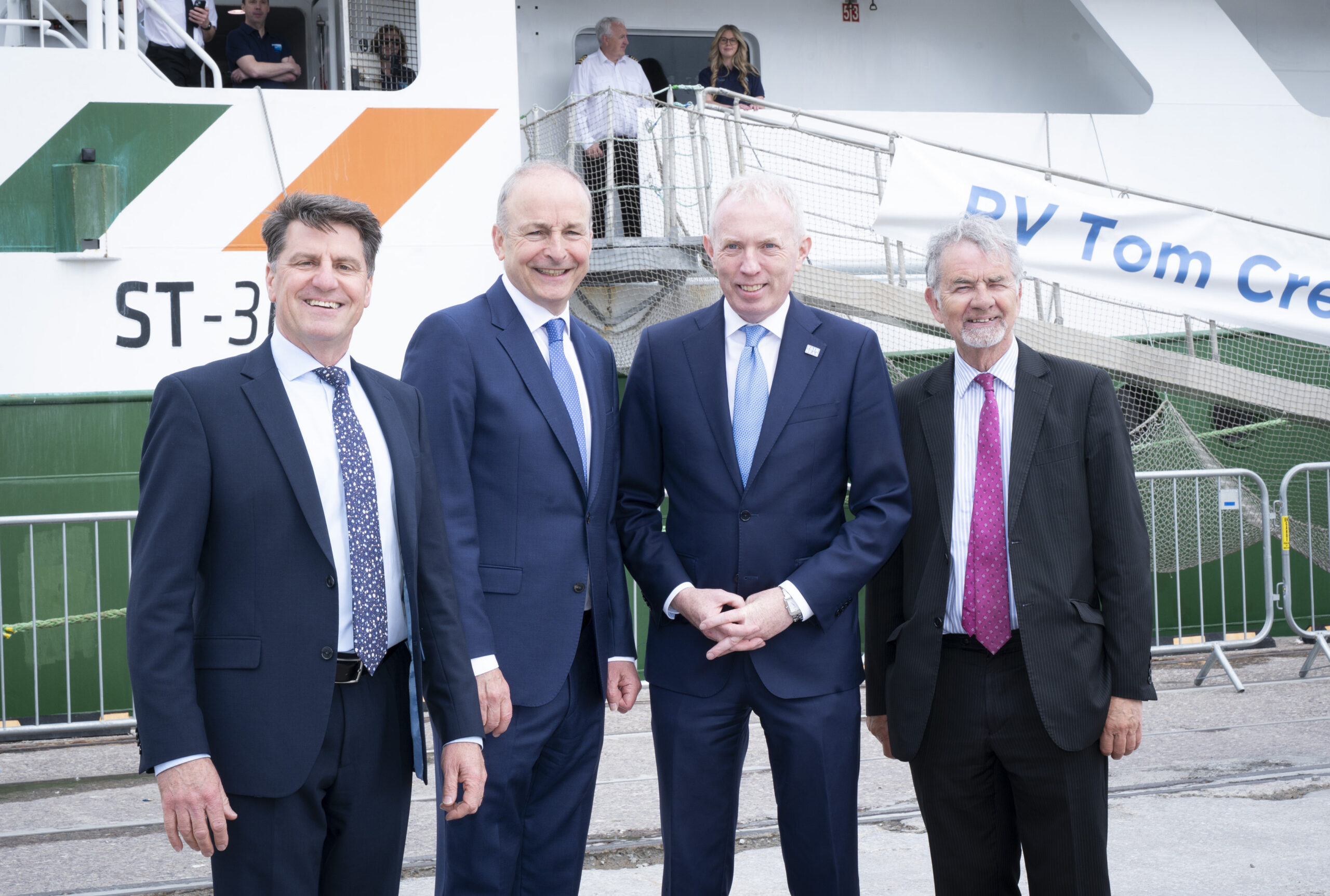 Taoiseach Micheál Martin, Minister of State Timmy Dooley, CEO of the Marine Institute Rick Officer and Chair of the Marine Institute board Martin Sisk on the background of the RV Tom Crean.  