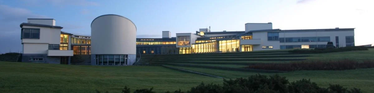 Marine Institute headquarters in Oranmore viewed across terraced lawns at dusk